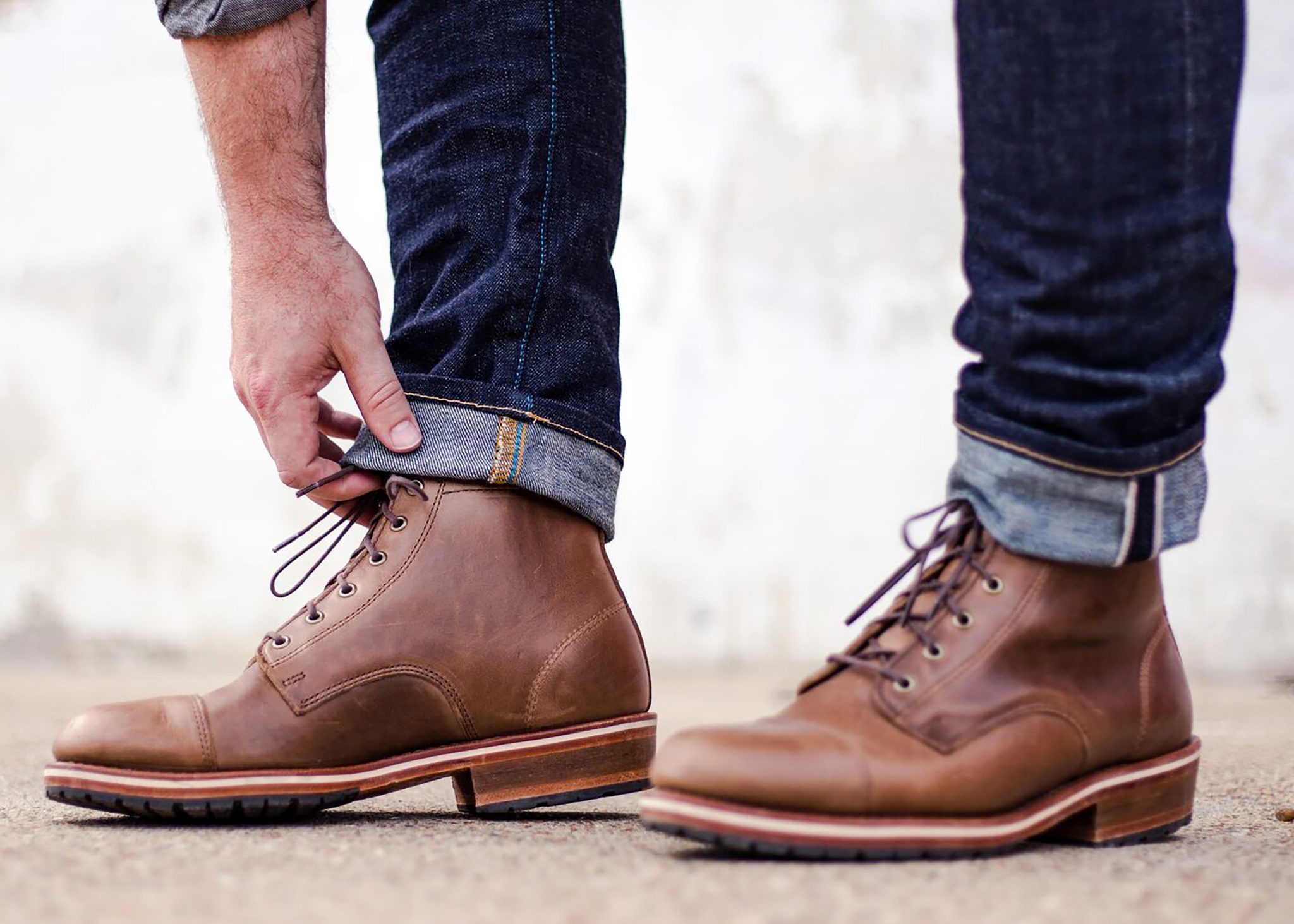 Man's blue jeans and boots