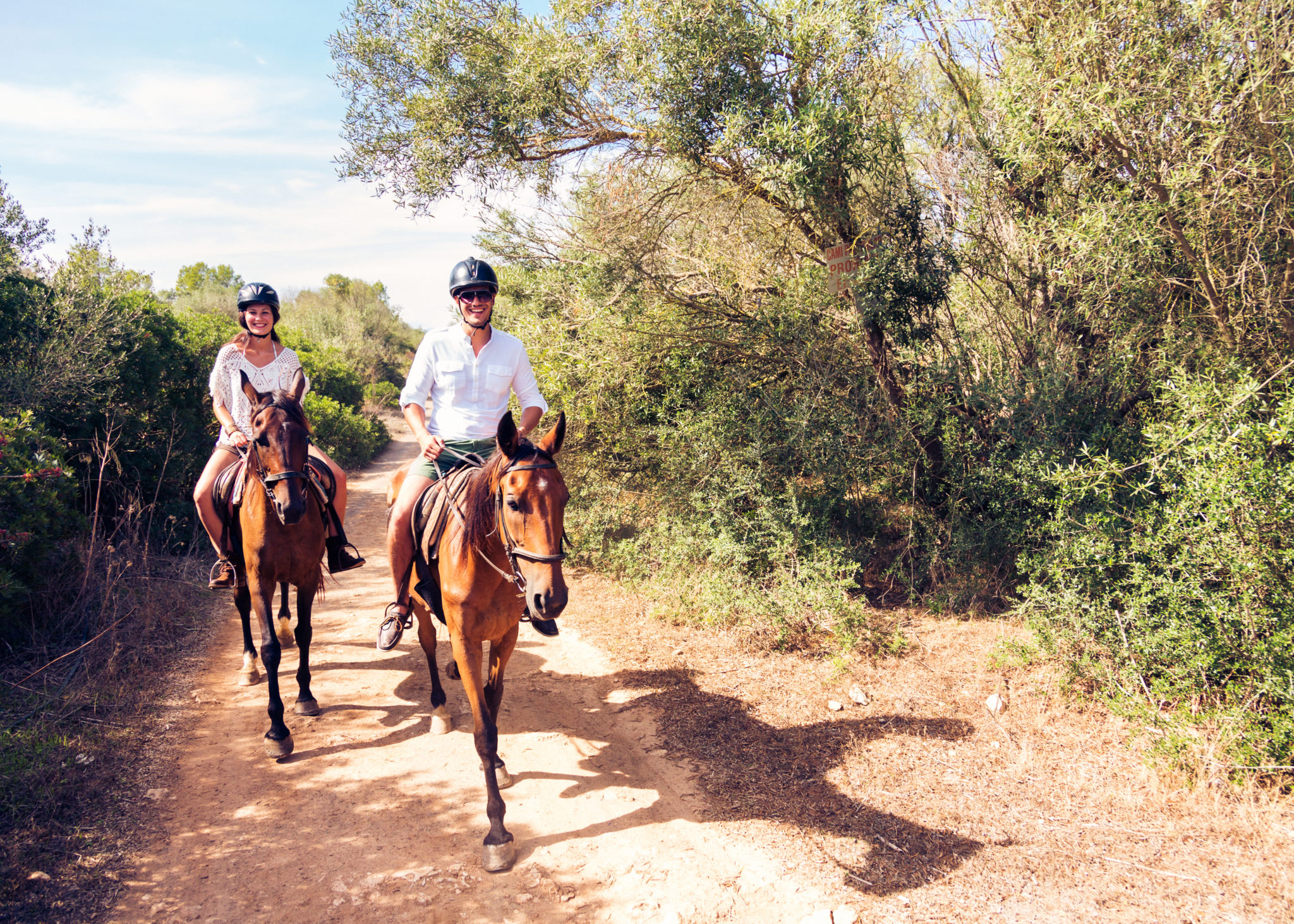 Man and a woman riding horses