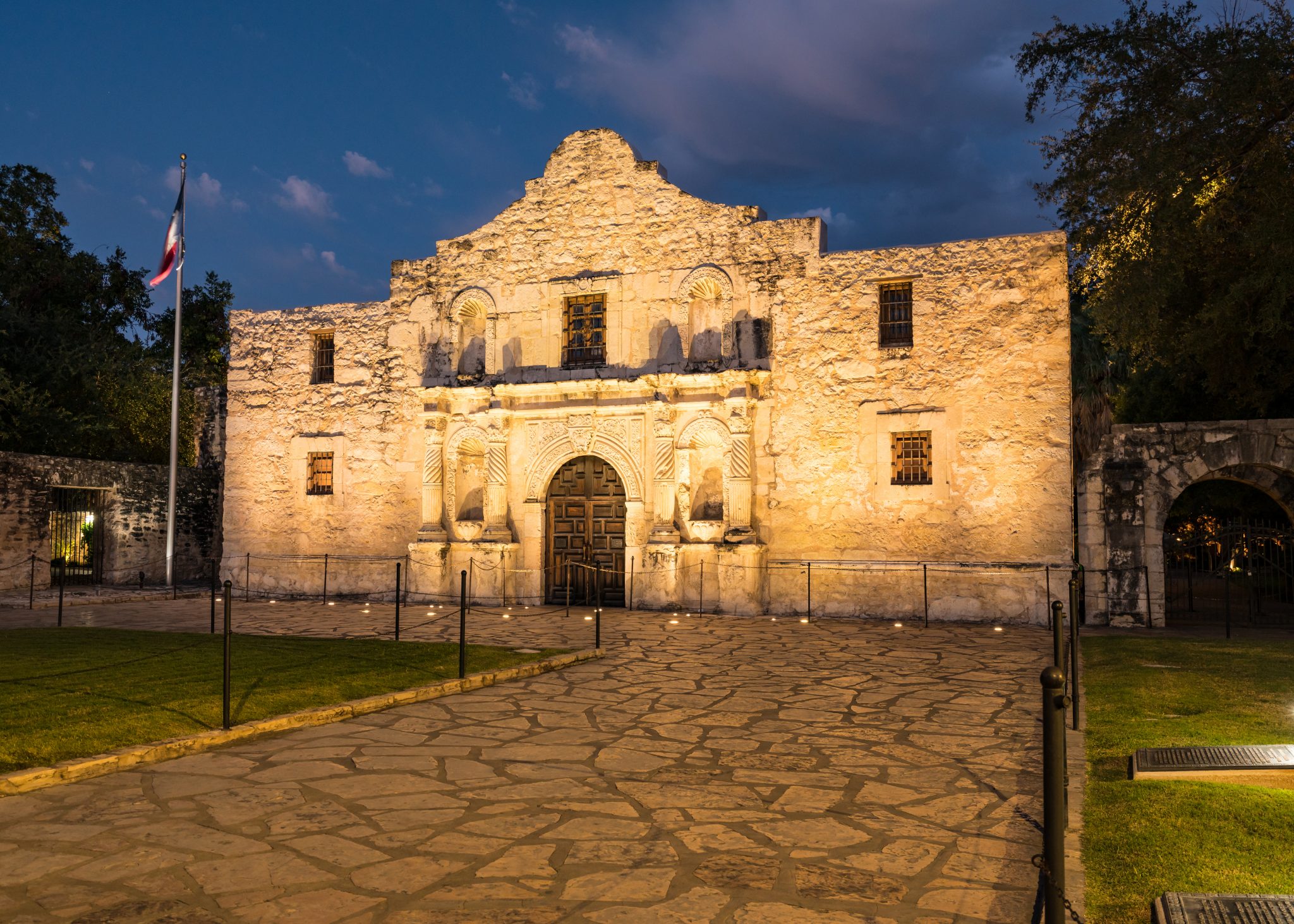 The Alamo lit up at dusk