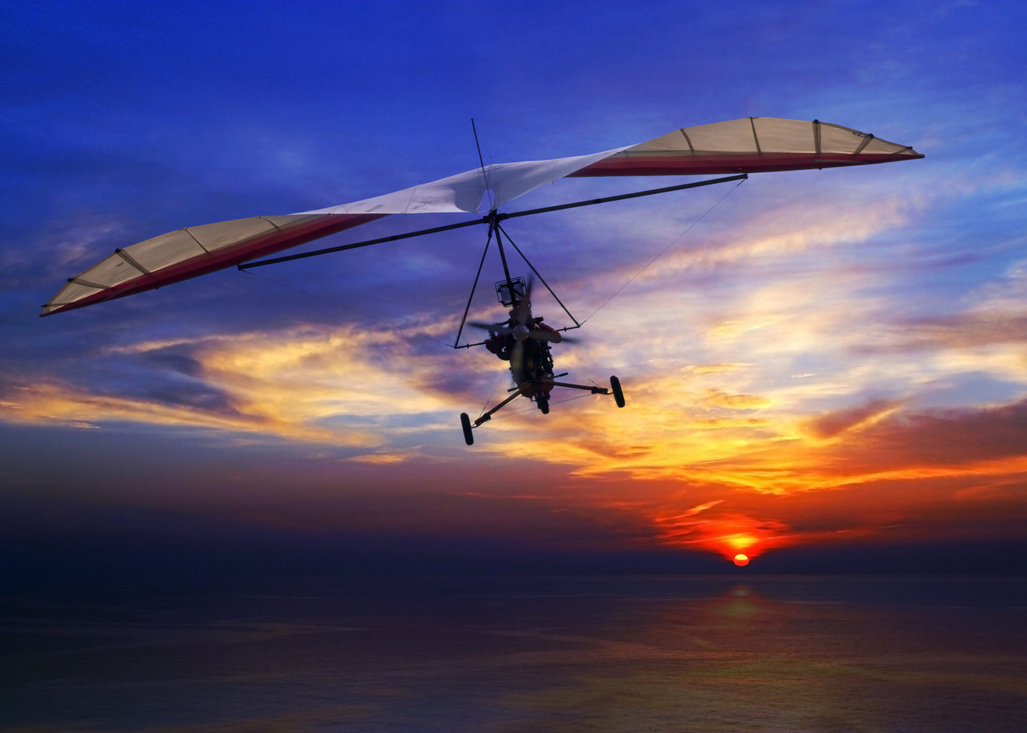 Hand glider in the sunset