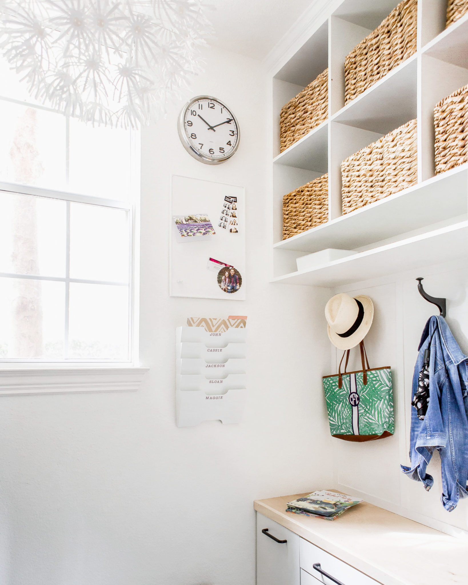 Entryway with hooks, clock, and paper storage