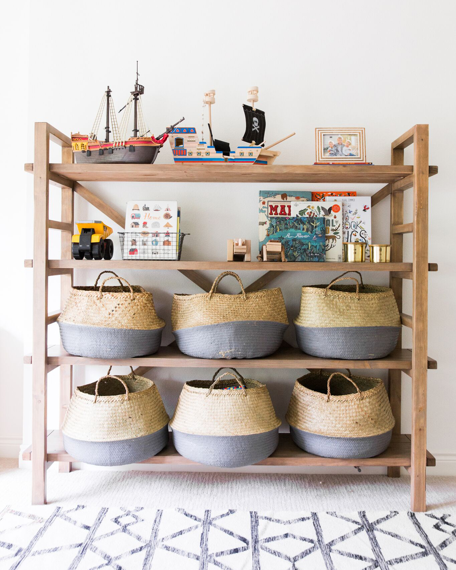 Shelving with childrens toys in bins