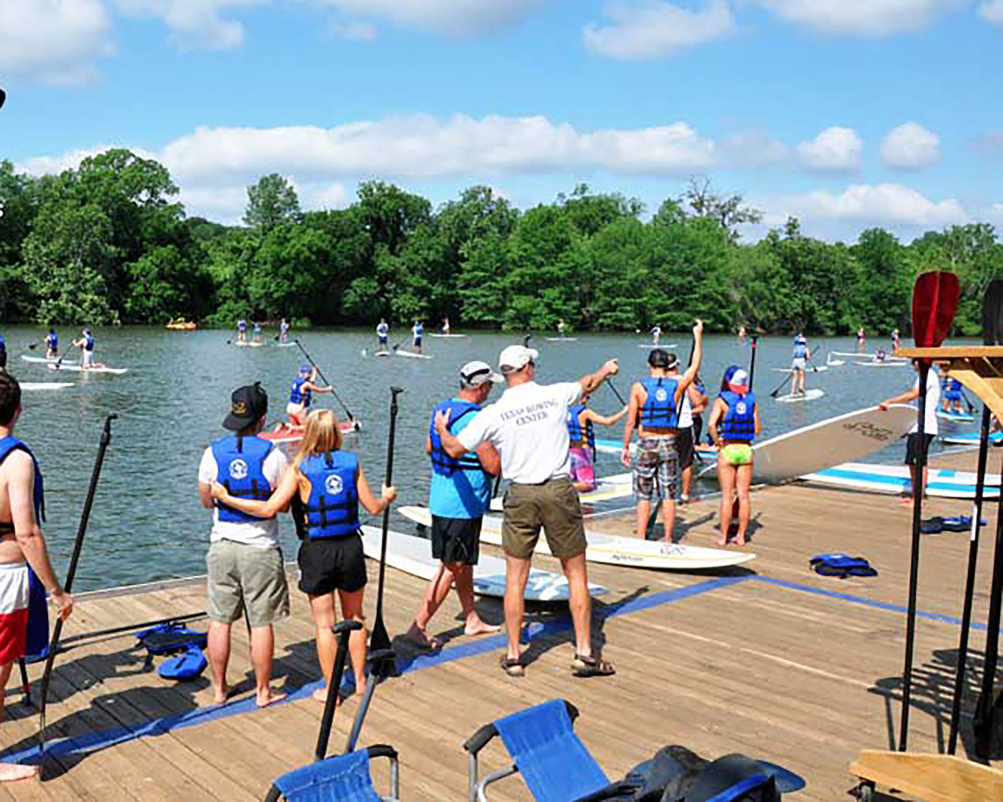 People getting ready to go paddle boarding