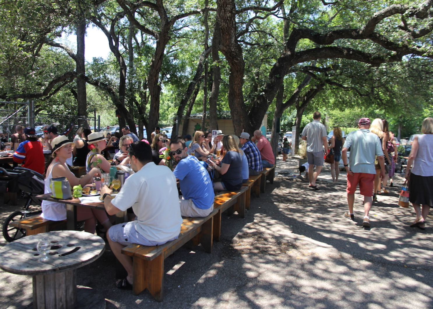 People sitting at outdoor dining tables