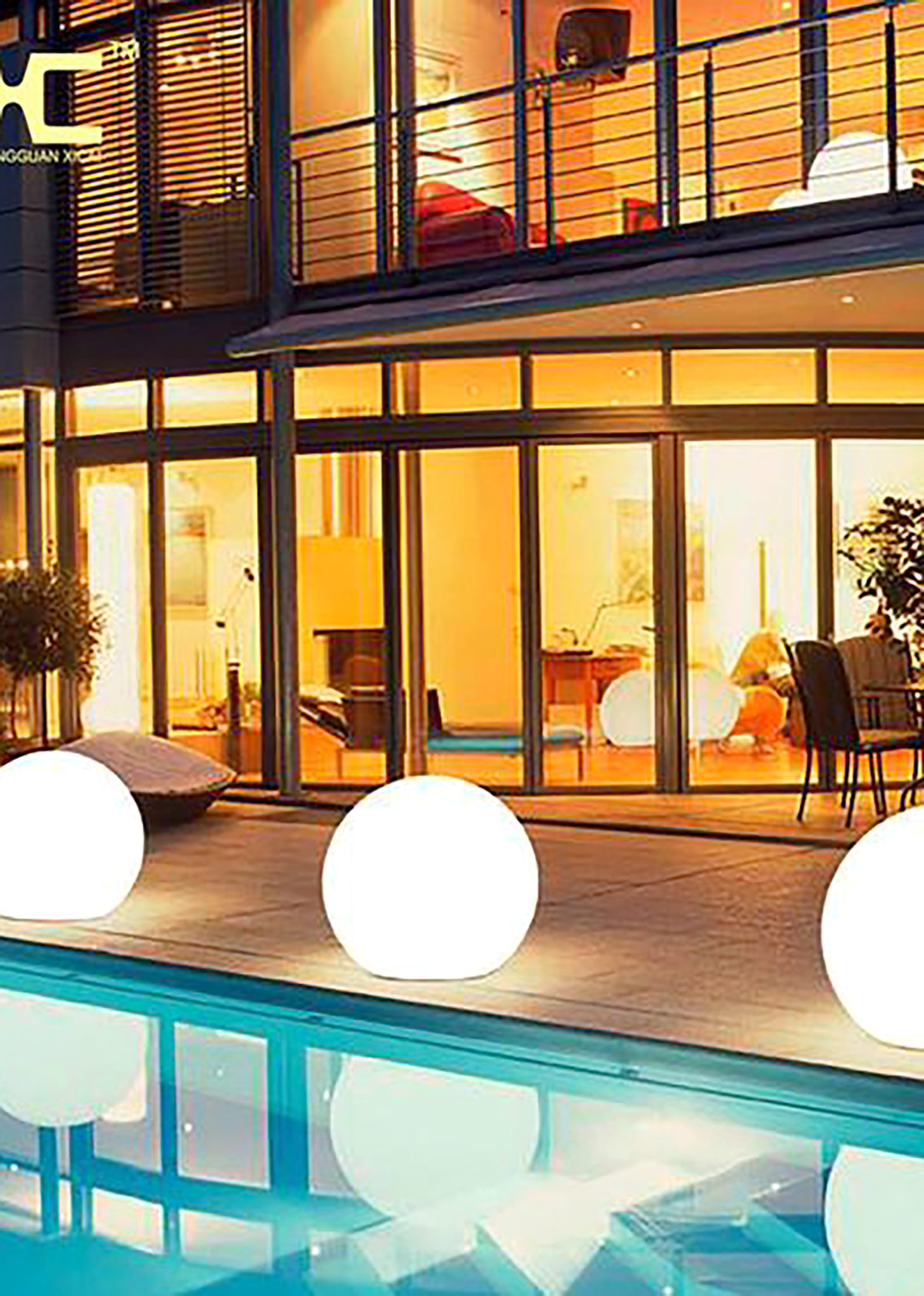 Large orb lights by a pool