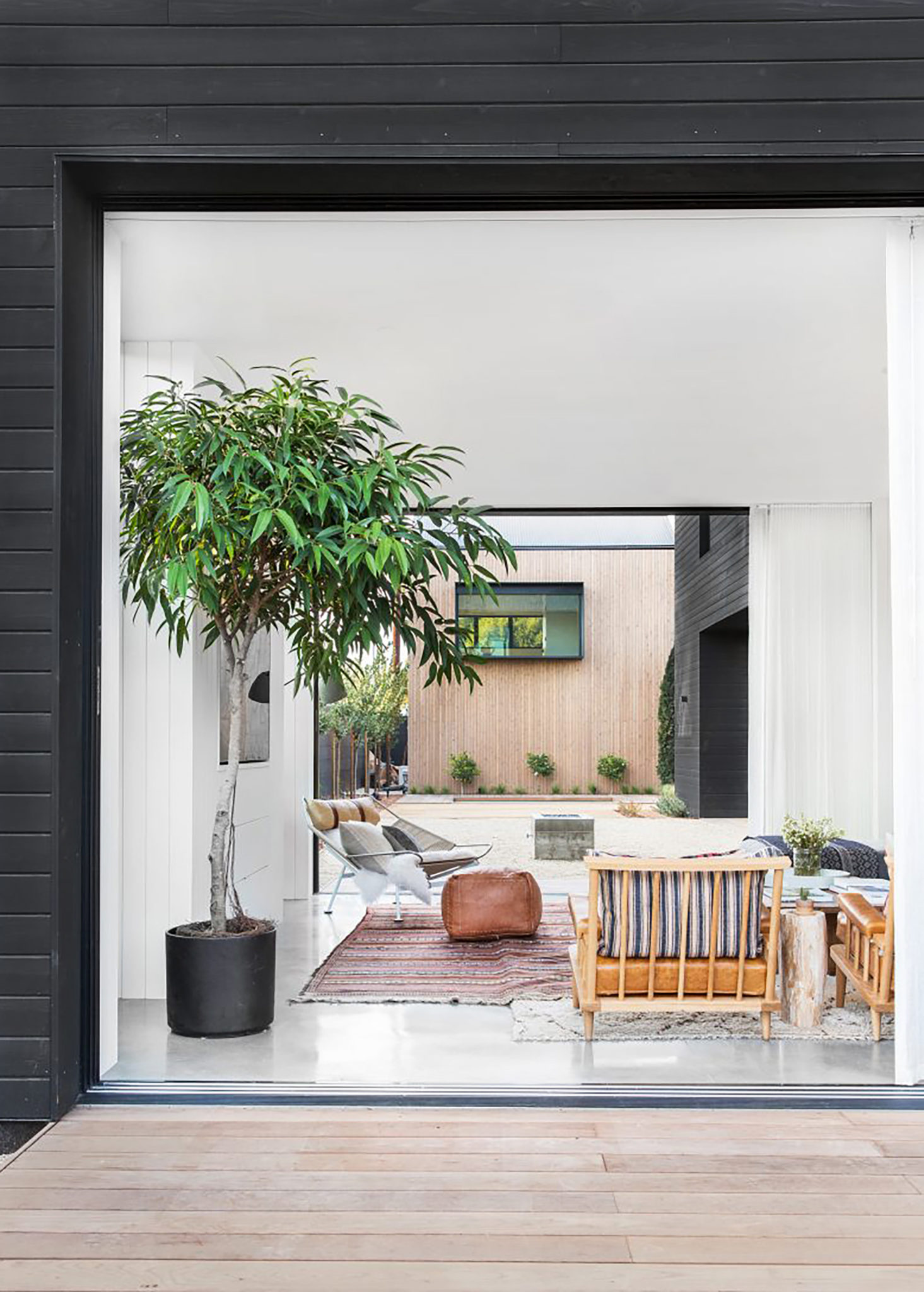 Outdoor seating area surrounded by lush greenery