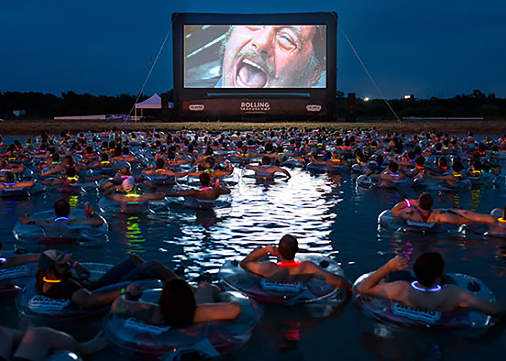 People floating on the water watching Jaws