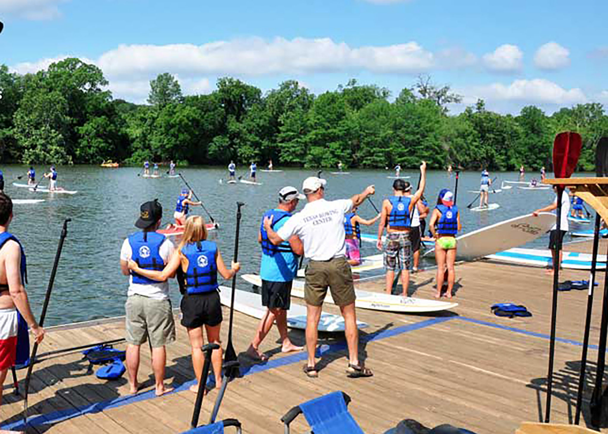 People getting ready to go paddle boarding