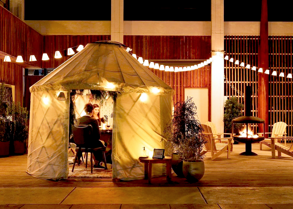 People dining in a yurt