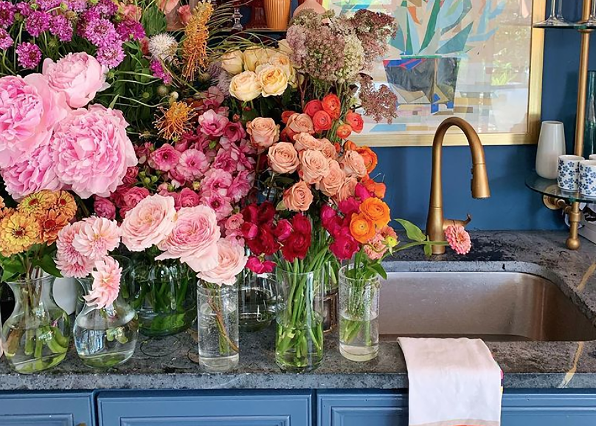 Glass jars of fresh cut flowers