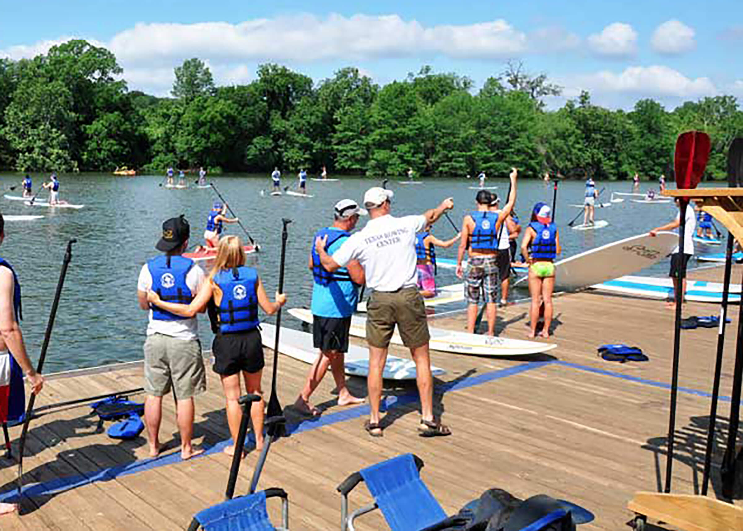 People getting ready to go paddle boarding